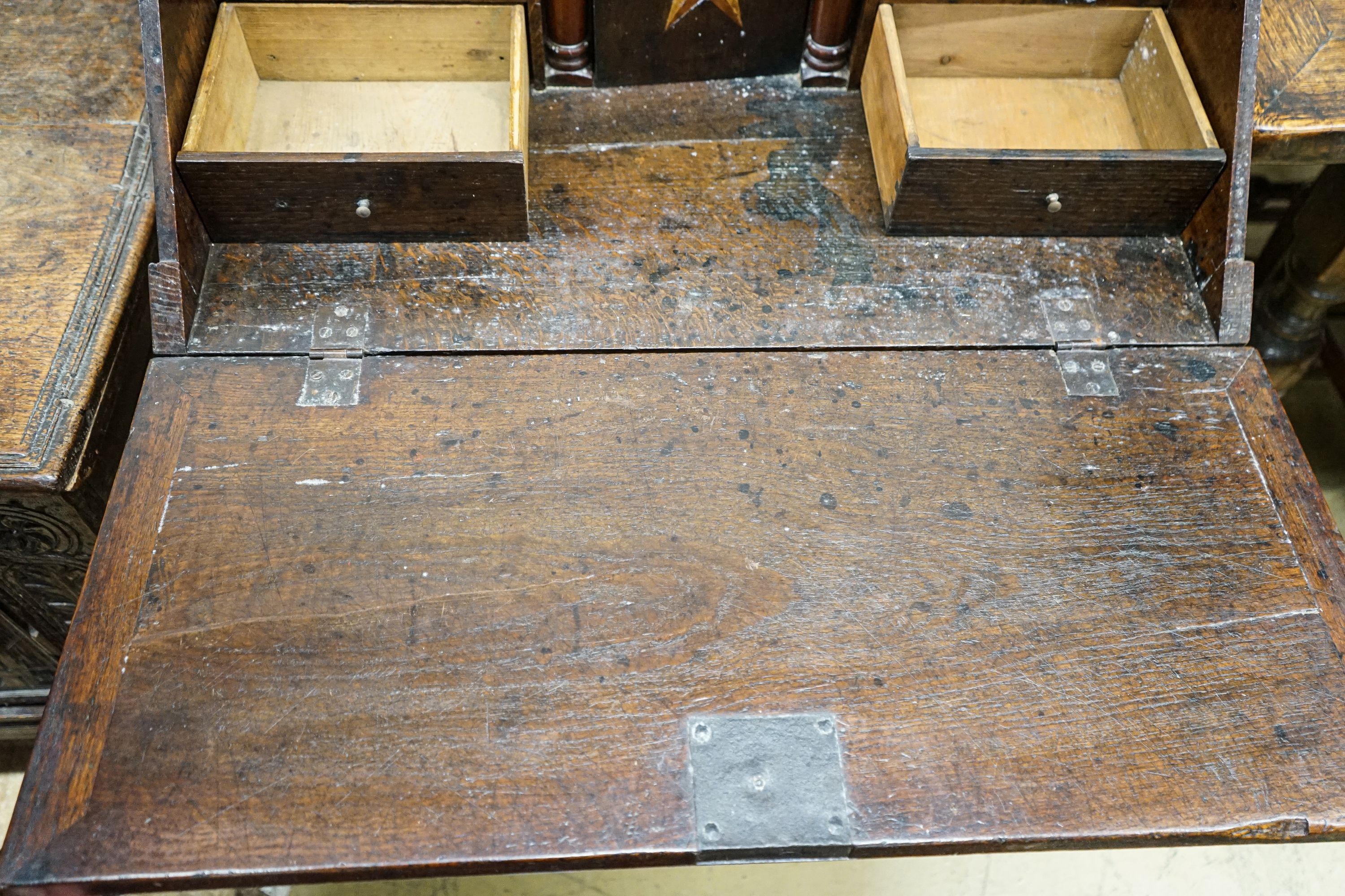 A mid 18th century inlaid oak and elm bureau, with fitted interior and single drawer, width 77cm, depth 45cm, height 94cm